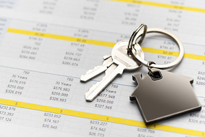 House keys with home charm on financial spreadsheet, a Business Photo by Olena Rudo