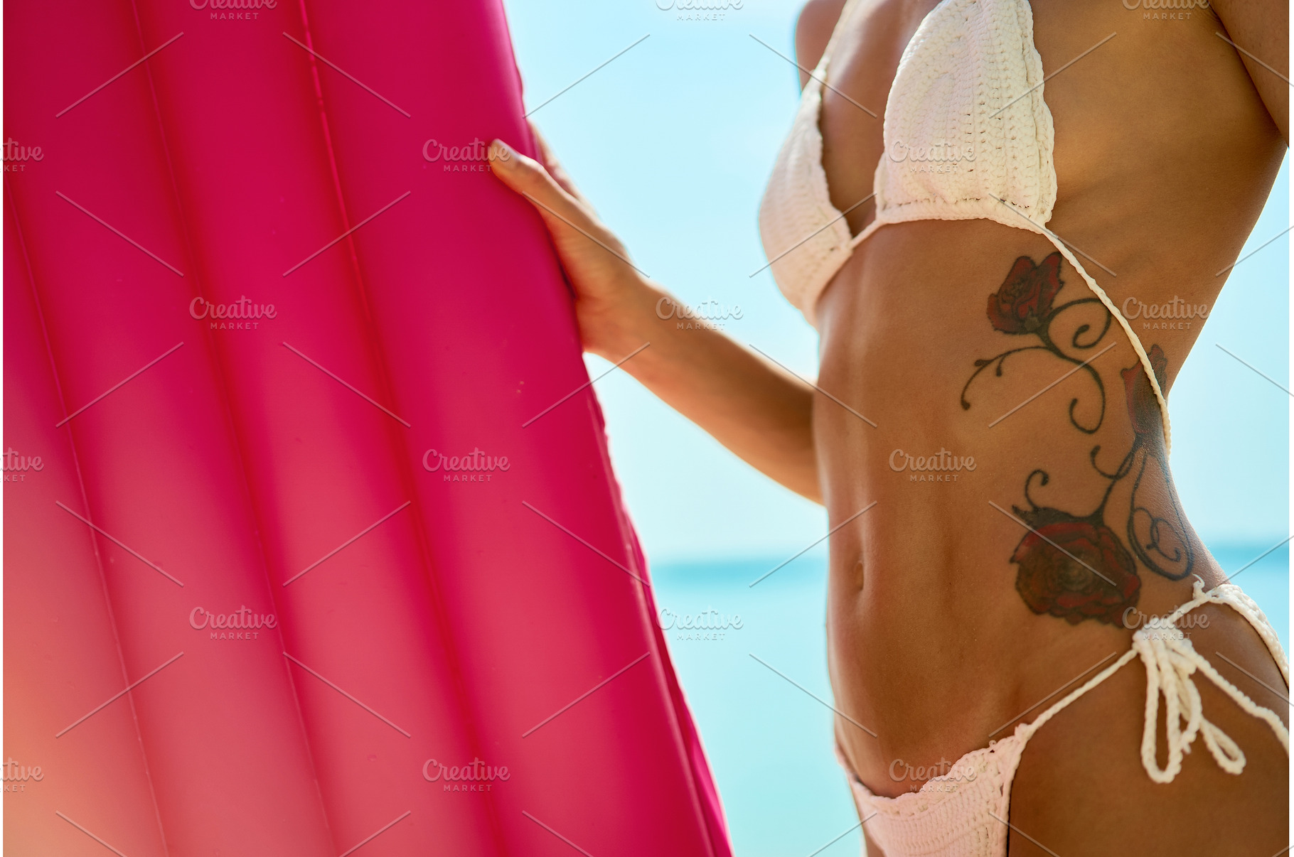 Tanned Woman Body in Bikini Holding, a Person Photo by vitaliymateha photography
