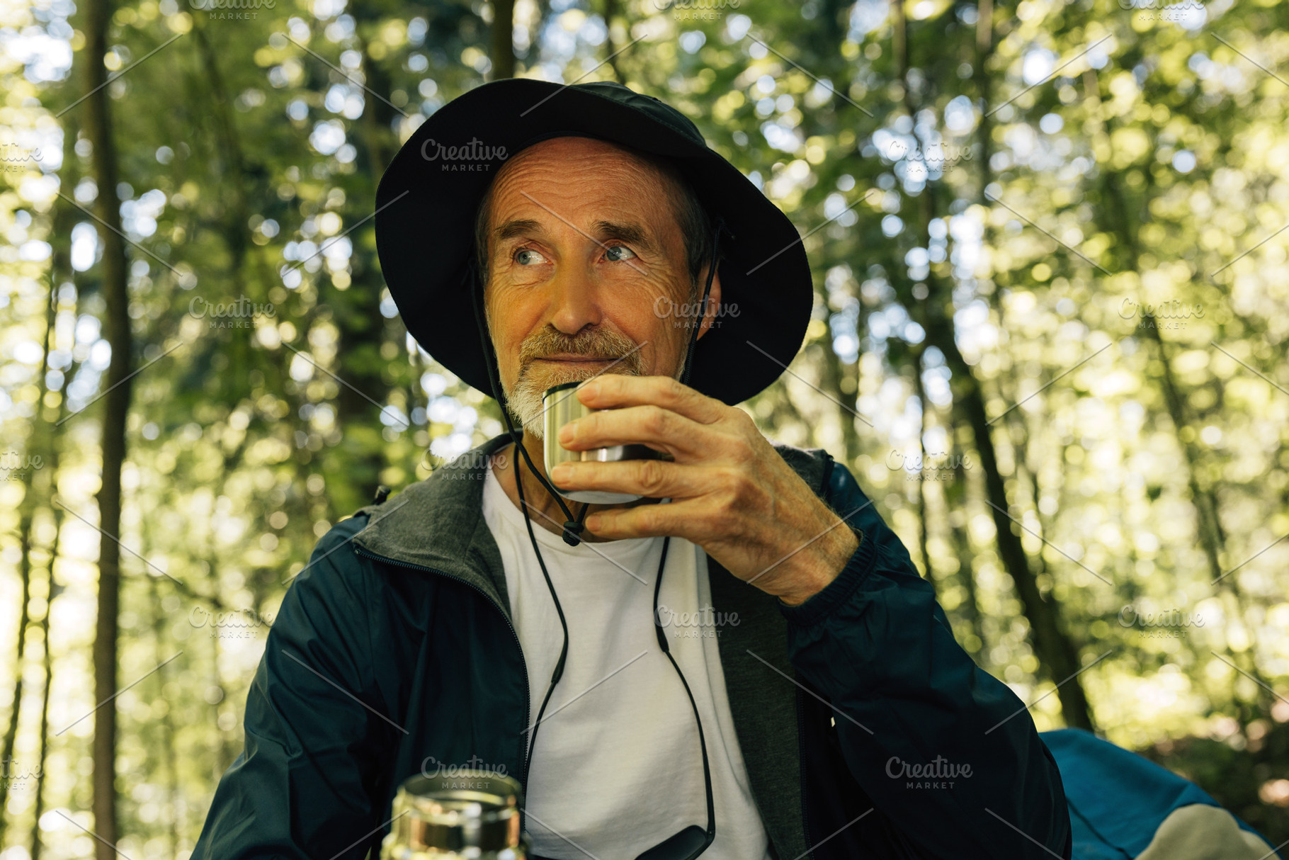 Male tourist in a hat drinks coffee, a Person Photo by Artem Varnitsin