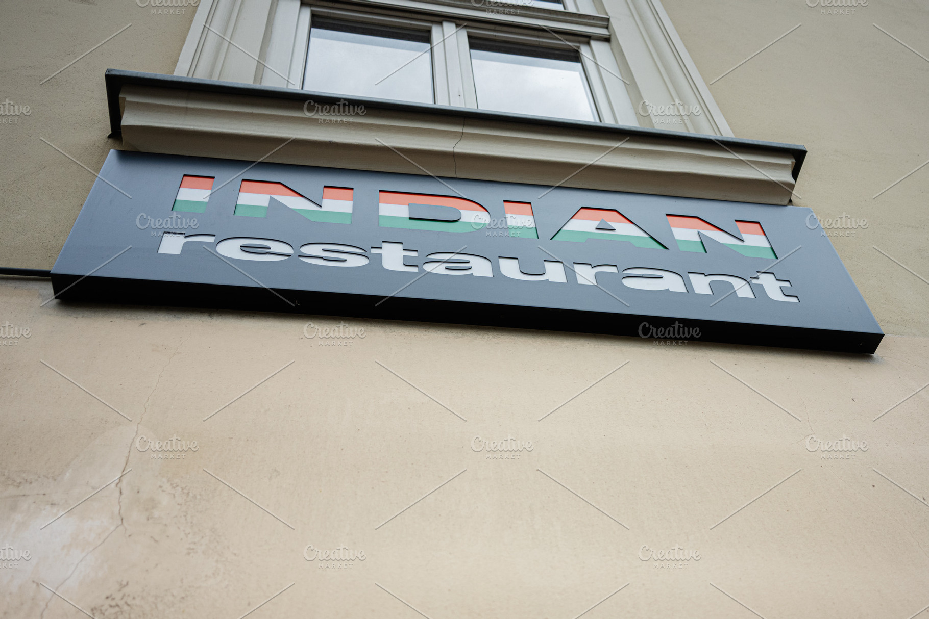 Signboard of Indian restaurant showcasing colorful text design, a Photo by AS photostudio
