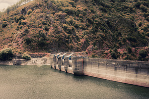 Hydroelectric dam in mountains, an Industrial Photo by SkyNext
