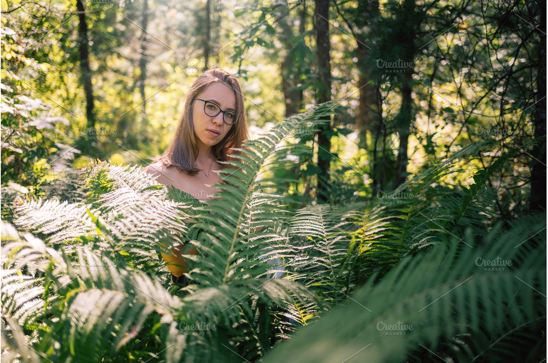 Woman Among Forest Ferns in Sunlight, a Person Photo by Jan Jack Russo Media