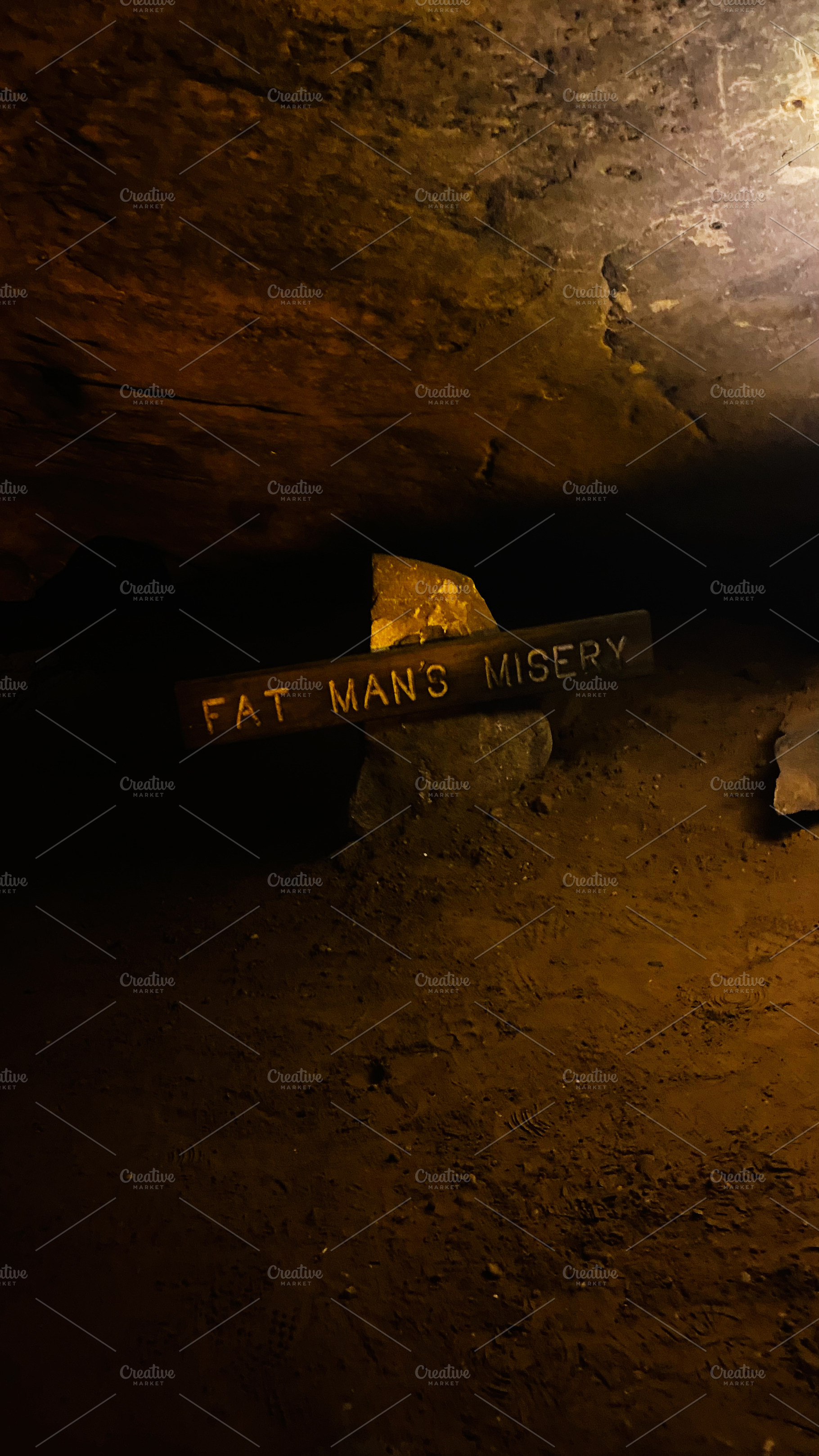 Fat Man's Misery sign in Mammoth Cave interior, Kentucky USA, a haunting underg, a Nature Photo by AS photostudio