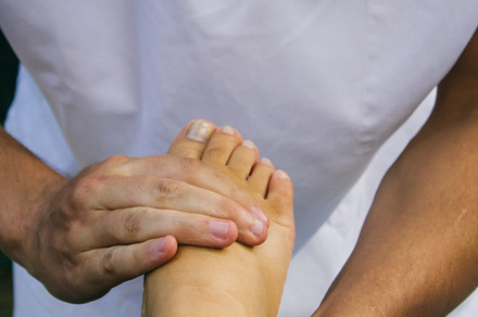 Physiotherapist treating a foot stock photo containing acupressure and body, a Health & Medical Photo by Am.Benitez Estudio