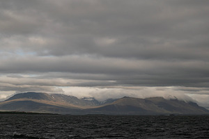Cloudy mountain landscape near Akranes, Iceland, with dramatic sky and serene w, a Photo by AS photostudio