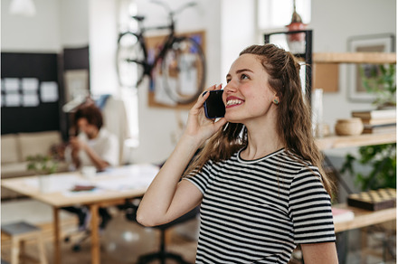 Young smiling woman calling in, a Business Photo by HalfPoint