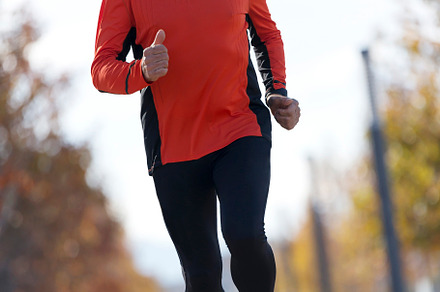 Senior man running outdoors in sportswear