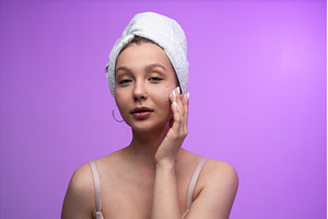 Woman with a fresh face and towel, a Person Photo by volodymyrshtun13795