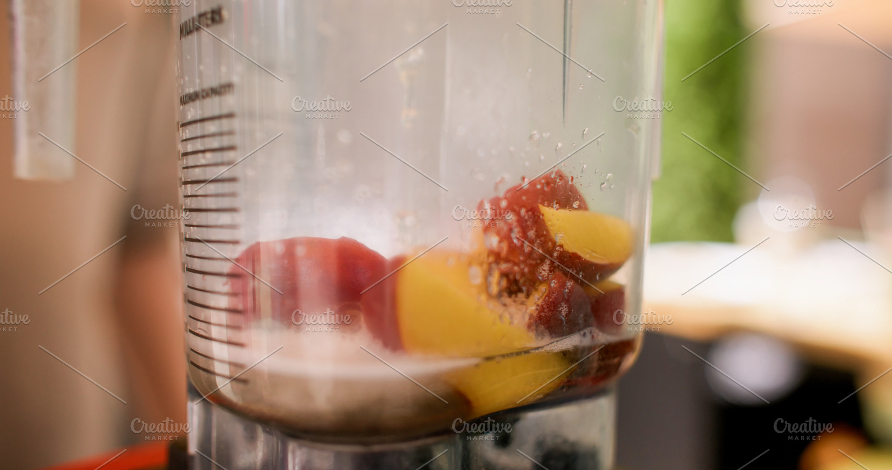 Electric blender making fruit drink peaches syrup, a Food & Drink Photo by Photo Drive Studio