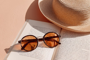 Summer hat and sunglasses, a Photo by Virgo Studio