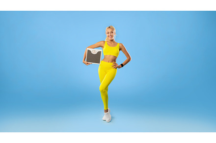 Portrait of Sporty Woman Holding, a Person Photo by Prostock-Studio