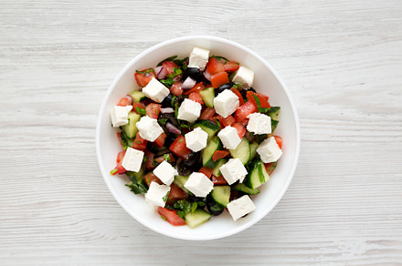 Homemade Shepherd's salad with cucumbers, feta and parsley in a, a Food & Drink Photo by LiudmylaChuhunova