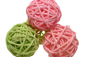 Pink and green rattan wicker ball on isolated background as a de, an Abstract Photo by ndanko