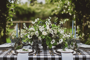 Rustic outdoor table setting showcasing a beautiful floral cente, a Photo by Studio ANNA