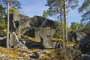 Old abandoned quarry containing quarry, block, and lump