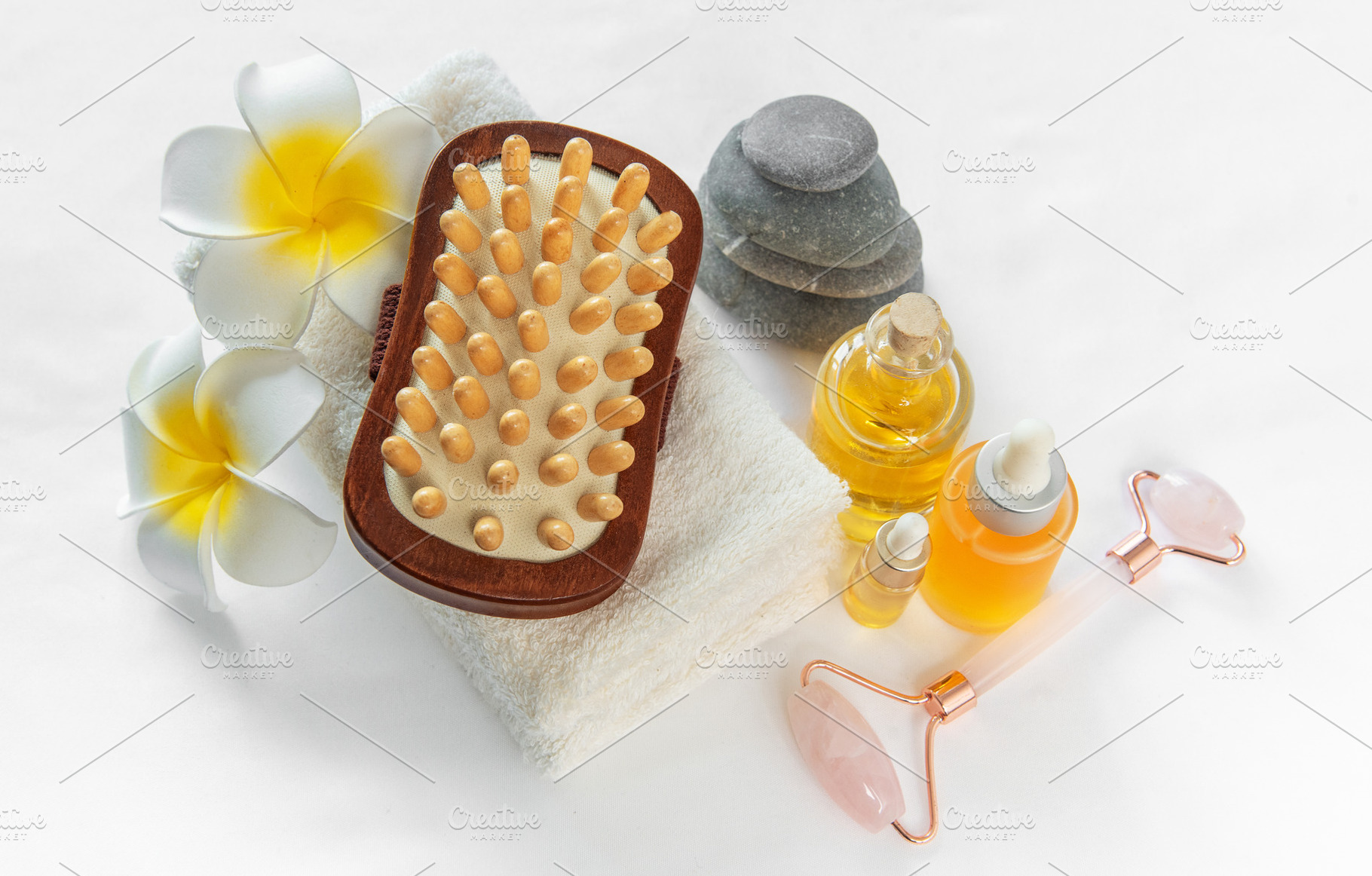 Spa wellness treatment with massage oil and stones, a Beauty & Fashion Photo by Olena Rudo