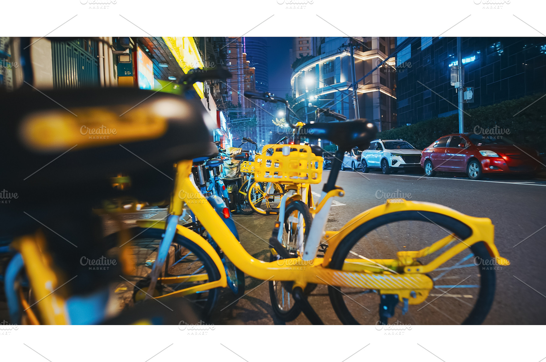 Bicycles and Cars Aligned Along a, a Transportation Photo by Our Amazing World