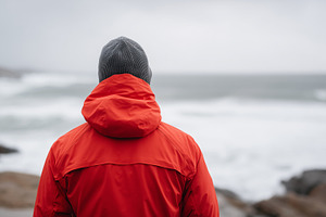 Rear view on a man in red jacket and, a Person Photo by MistyDay