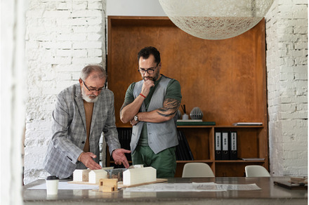 Young architect consulting project, a Business Photo by HalfPoint