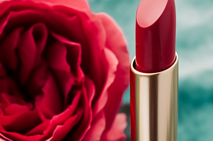 Red lipstick in a golden tube and blooming rose flower, beauty c, a Beauty & Fashion Photo by Anneleven