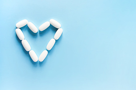 White pills  in the shape of heart, a Health & Medical Photo by pictures for you