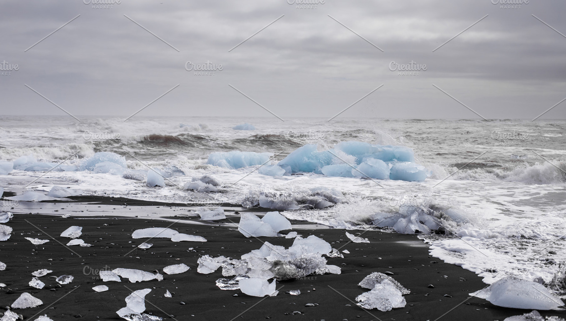 Black sand beach with ice containing mountains, beauty, and arctic, a Nature Photo by grycikua
