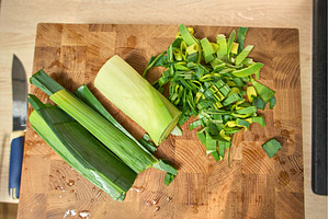 Chopping leeks on a wooden cutting, a Food & Drink Photo by darksoul72