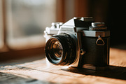 Vintage Camera on a Wooden Table, an Arts & Entertainment Photo by Virgo Studio (Thumbnail 1 of 2)