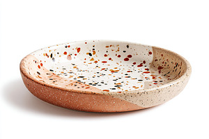 Round ceramic plate with colorful speckles perfect for serving on a dining tabl, a Food & Drink Photo by AlyaAnd