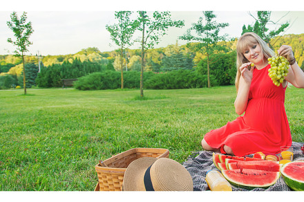 Pregnant woman on a picnic, a Person Photo by yanadjana