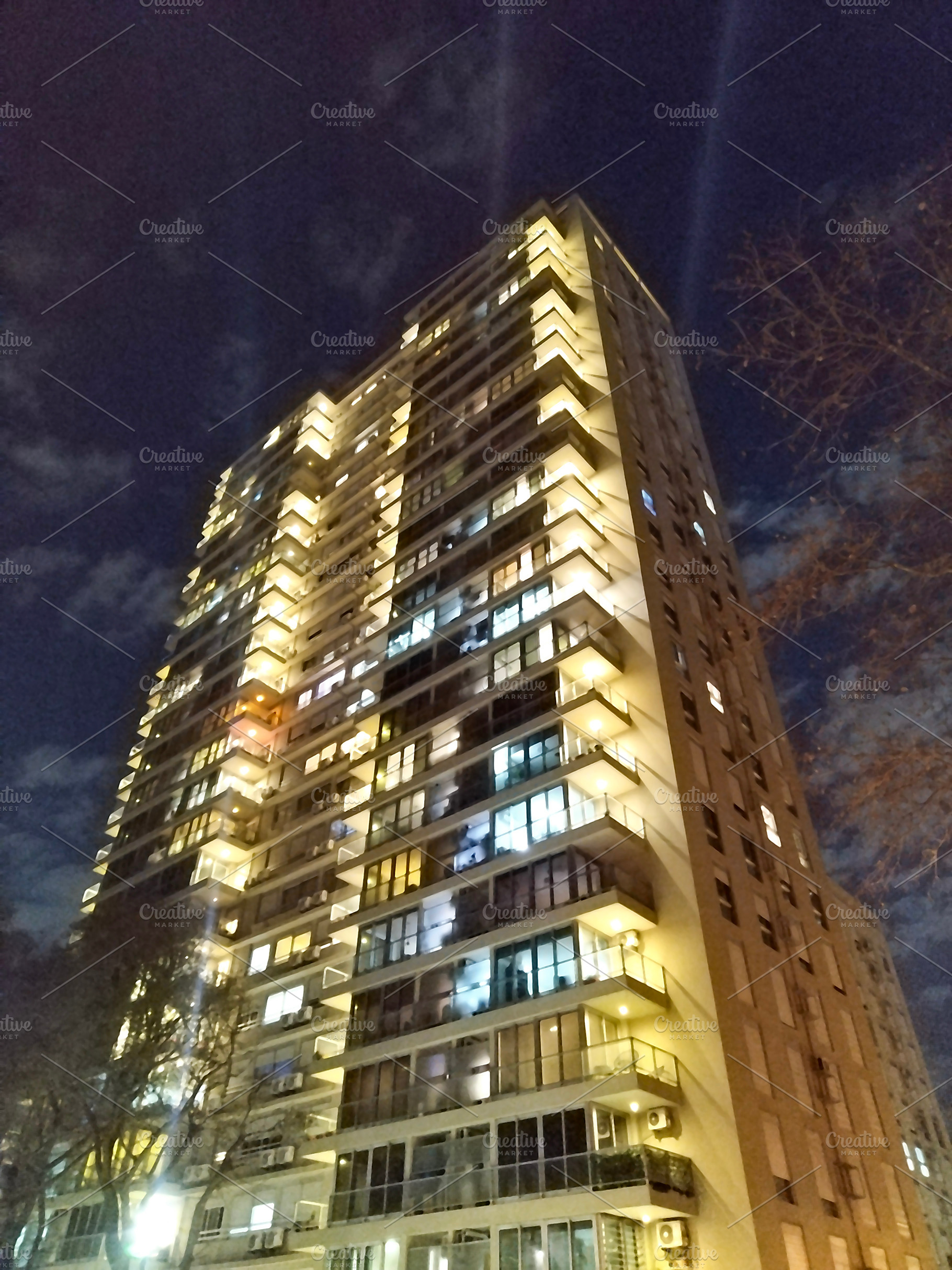 Modern apartment building night scene, montevideo, uruguay, an Architecture Photo by DanFLCreativo
