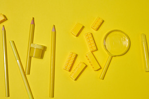 Collection of yellow stationery, building brick, and magnifying, a School & Education Photo by ndanko