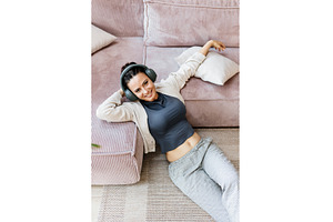 Woman relaxing at home, enjoying, a Person Photo by HalfPoint
