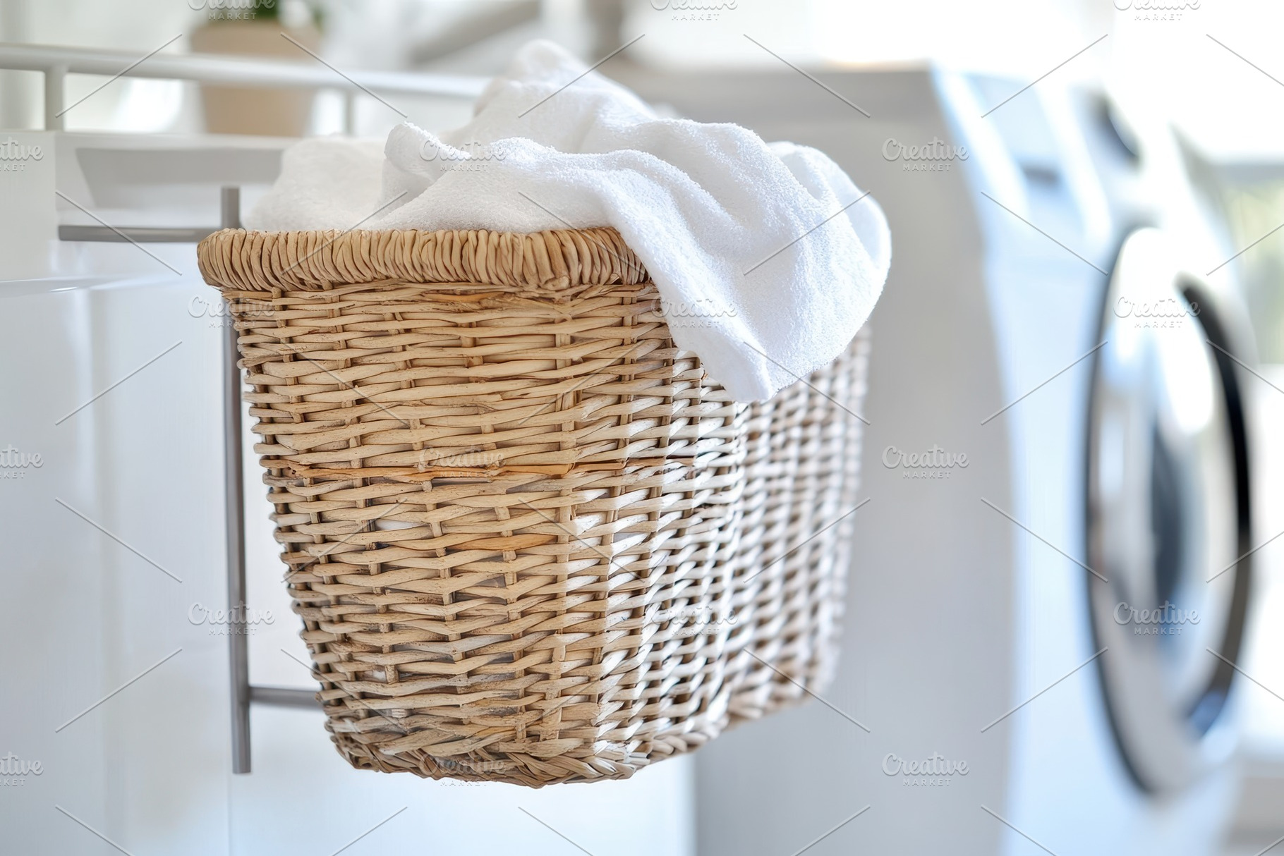 Laundry basket with clean towels on, a Photo by Iftikhar Alam
