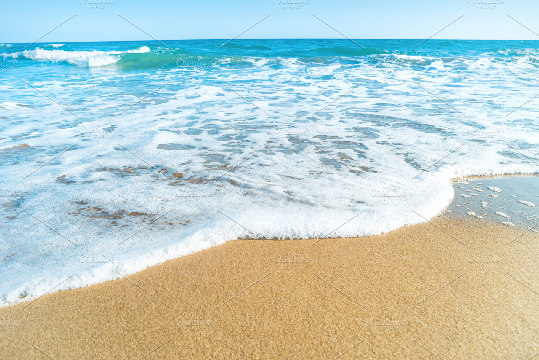 Tropical beach with sand and sea stock photo containing beach and sand, a Nature Photo by Vapi