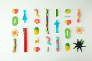 Gummy candies on white background, top view, a Food & Drink Photo by AtlasStudio PRO