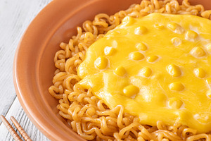 Cheesy Korean ramen with sweet corn and creamy melted cheese in