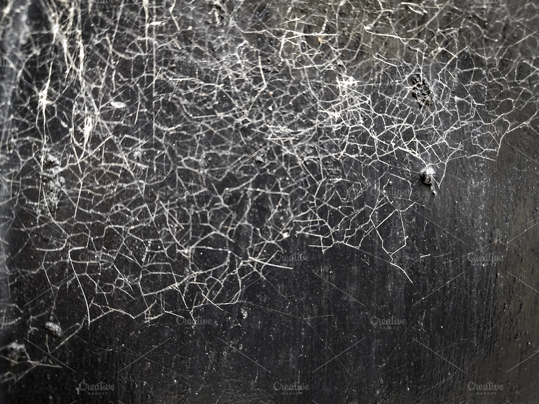 Dry soil showing and spideweb on top, an Abstract Photo by DanFLCreativo