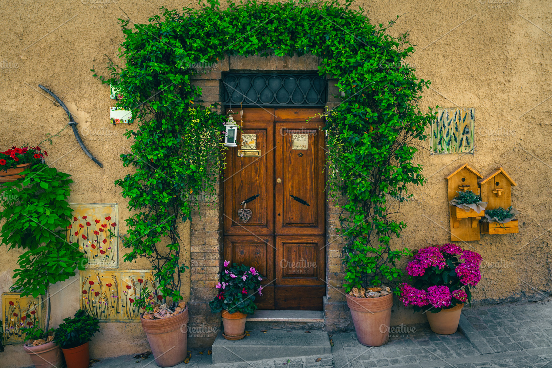 Entrance decorated with flowers, an Architecture Photo by Alpine Dreams