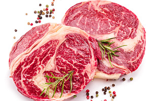 Raw beef steak on a white, a Food & Drink Photo by Volff