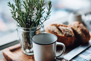 Rustic breakfast with cup, bread, a Food & Drink Photo by MistyDay