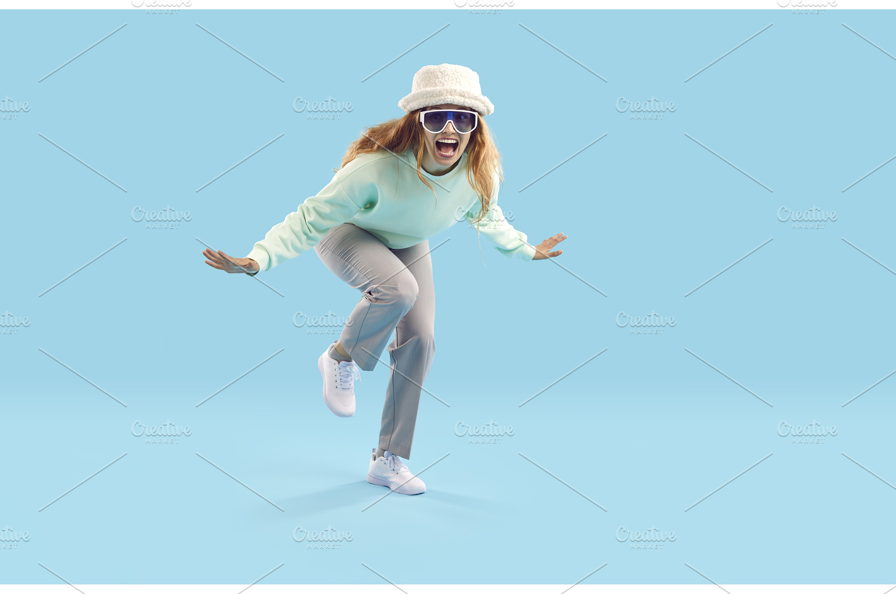 Cheerful crazy young woman laughs, a Person Photo by StudioRomantic