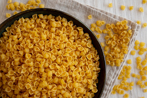 Homemade Perlini Pasta in a Bowl, top view. Flat lay, overhead,, a Food & Drink Photo by LiudmylaChuhunova