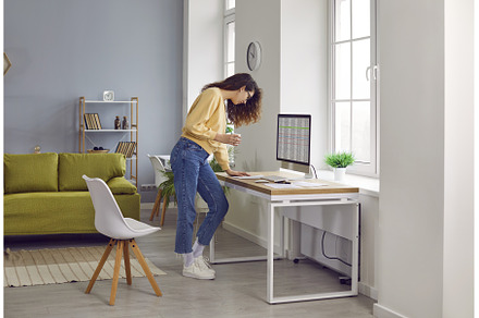 Woman accountant working at home, a Business Photo by StudioRomantic