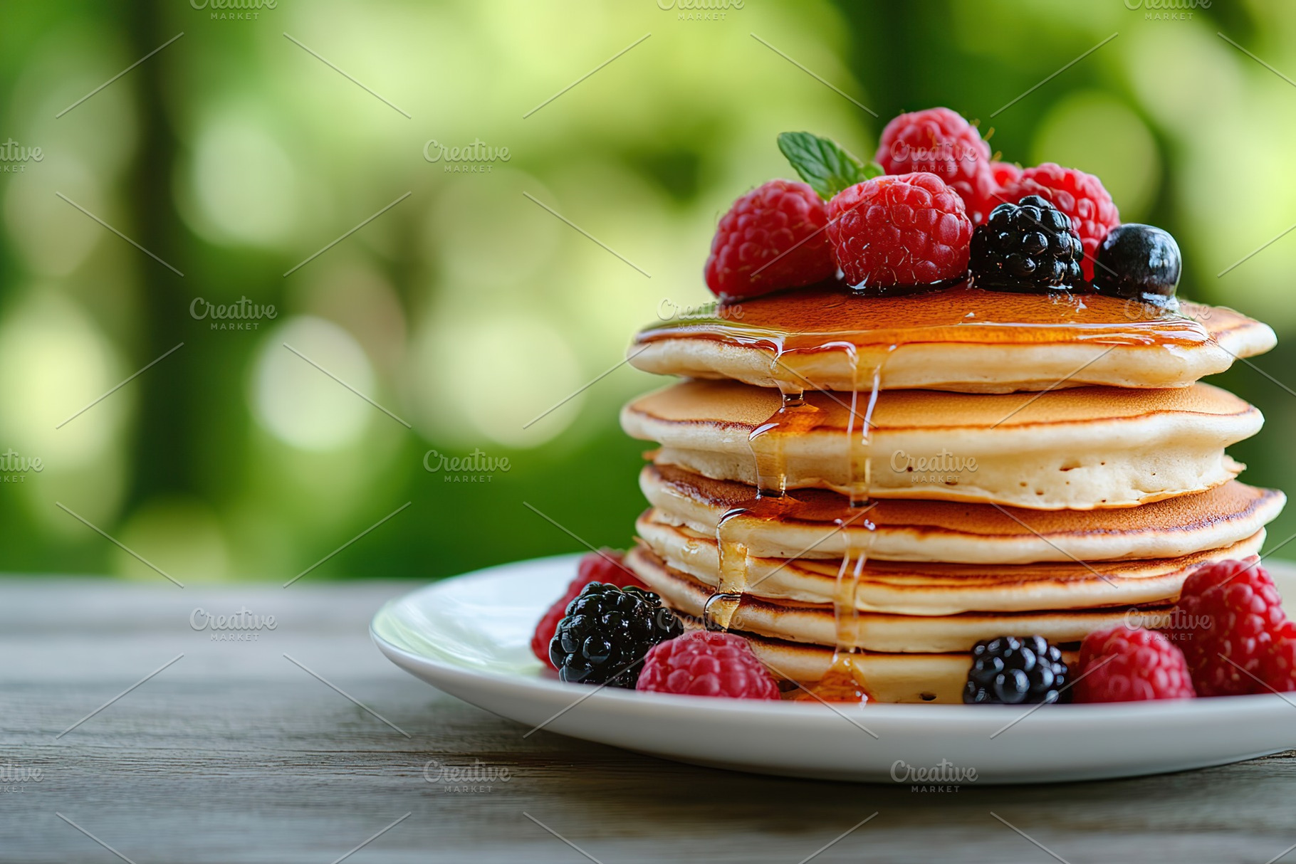 Stack of pancakes topped with fresh berries and dripping syrup against a natura, a Food & Drink Photo by AlyaAnd