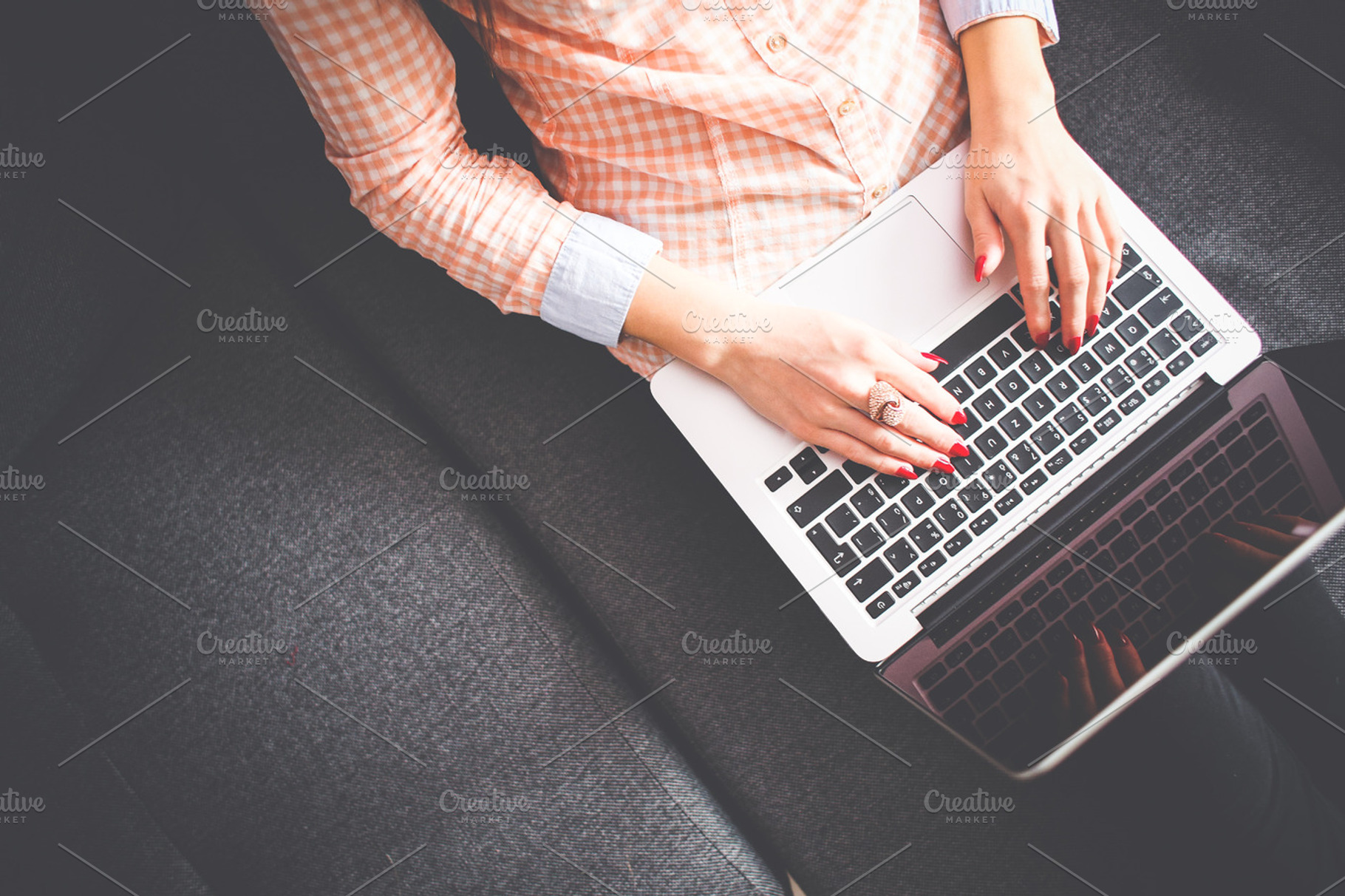 Girl typing on macbook from abov containing macbook, laptop, and office, a Business Photo by Viktor Hanacek