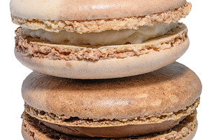 Chocolate macaron on isolated background, close up, a Food & Drink Photo by ndanko
