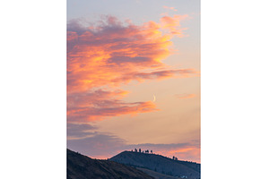 Fiery sunset clouds enveloping the, a Nature Photo by Backyard Stock