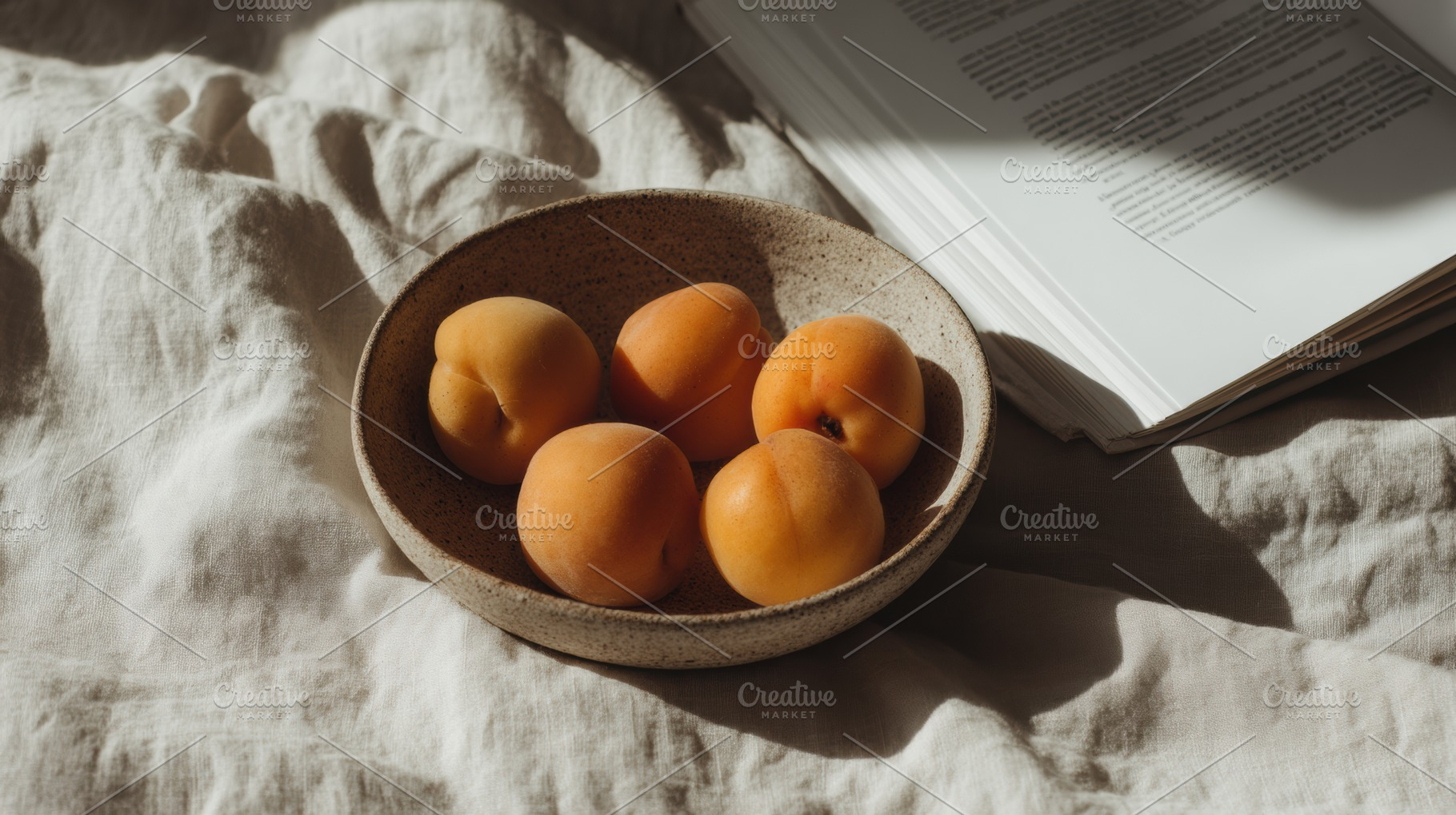 Clay bowl with apricots on table, a Food & Drink Photo by Virgo Studio