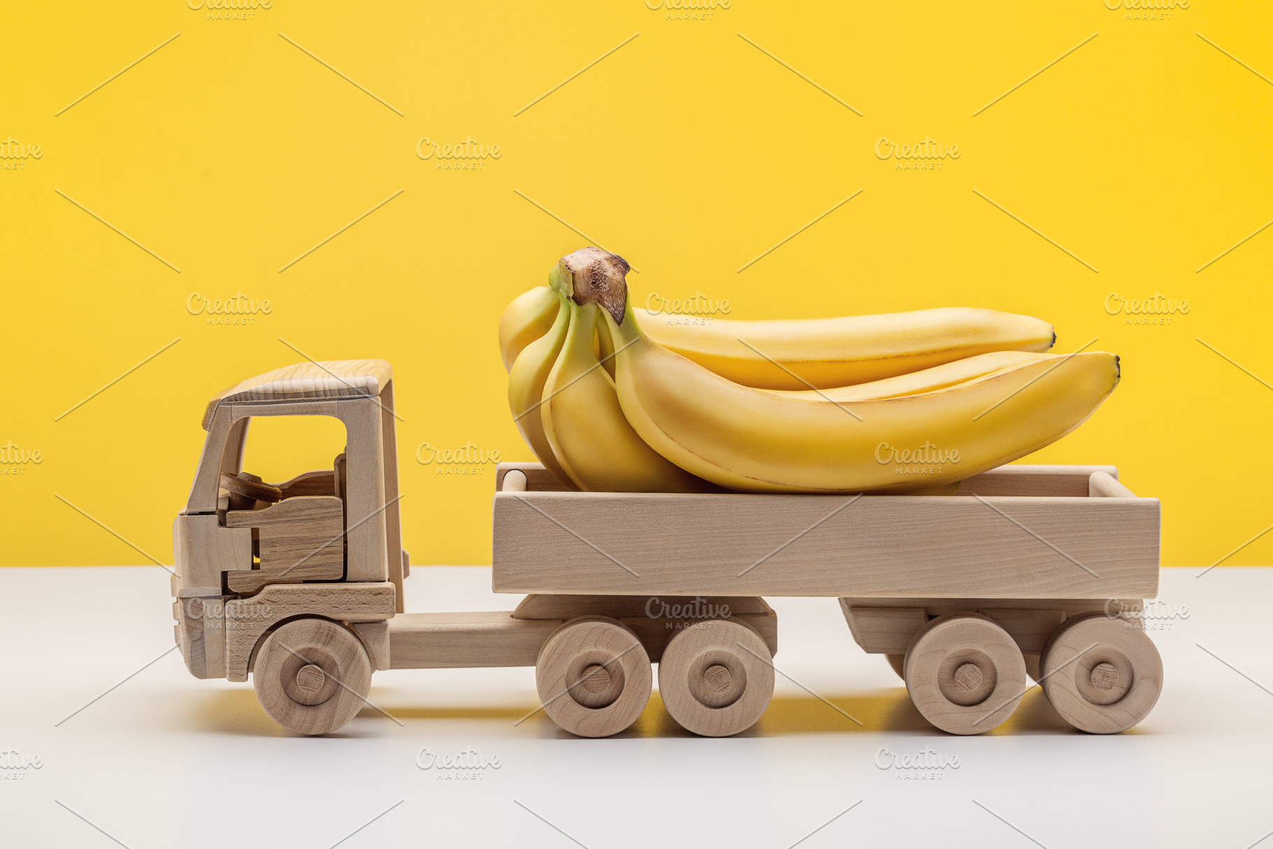 Wooden toy truck with bananas featuring banana, bunch of bananas, and yellow, a Food & Drink Photo by Dreamer63